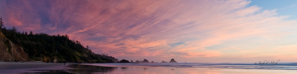 Brilliant pink fan shaped sunset over Cannon Beach.