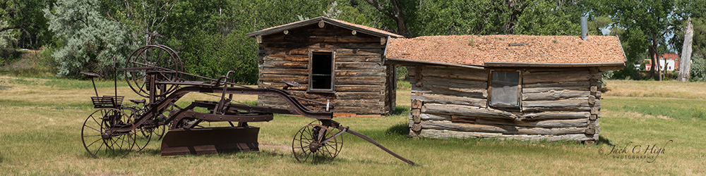 Historic cabins and plow in Miles City.